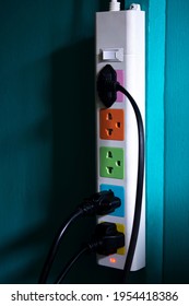 Many Electrical Plugs Connected To A Power Strip Or Extension Cord.