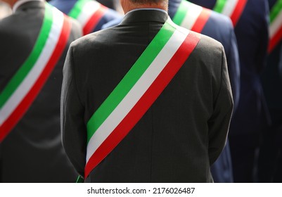 many elegant Italian mayors with elegant dress during the official ceremony with the tricolor green white and red sash - Shutterstock ID 2176026487
