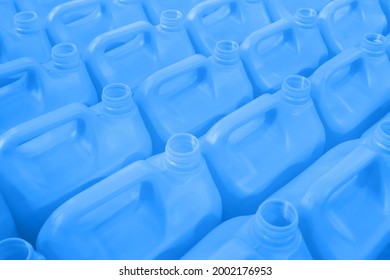 Many empty blue plastic jerrycans background in warehouse, market, factory or exhibition