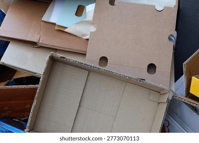 Many empty cardboard boxes piled up in a stack.