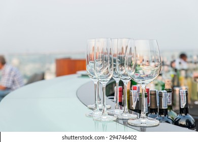 Many Empty Glass On Counter At Rooftop Bar