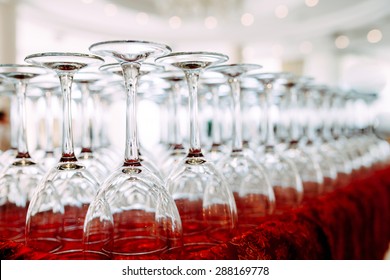 Many empty glasses for a wine drying in the bar. Close up photo with selective focus