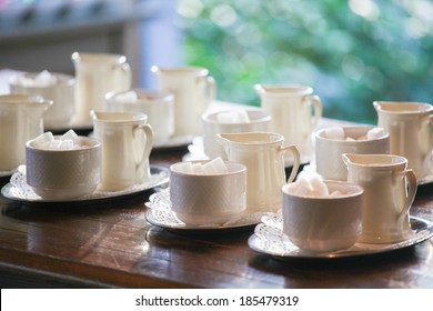 Many empty white cups arranged for a coffee break. - Powered by Shutterstock