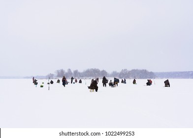 Many fishermen are fishing. Ice fishing - Shutterstock ID 1022499253