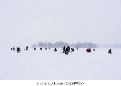 Many fishermen are fishing. Ice fishing - Shutterstock ID 1022499277