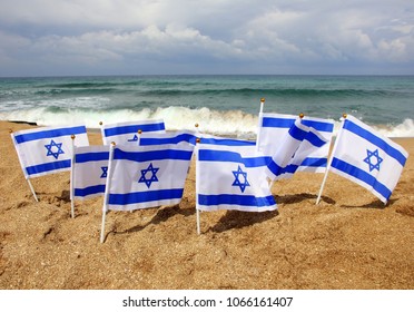 Many Flags Of Israel On The Beach