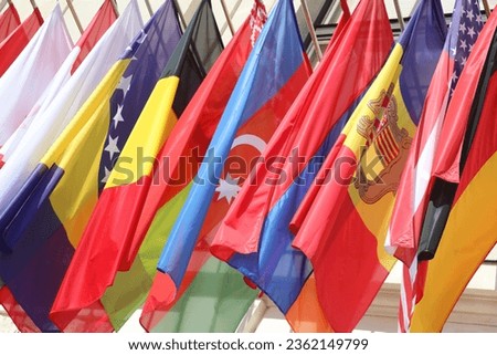 many flags of some nations of the world fly together