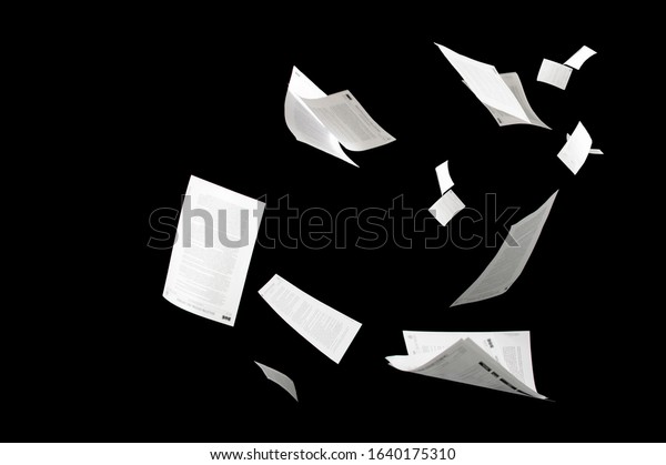 Many flying business\
documents isolated on black background Papers flying in air in\
business concept