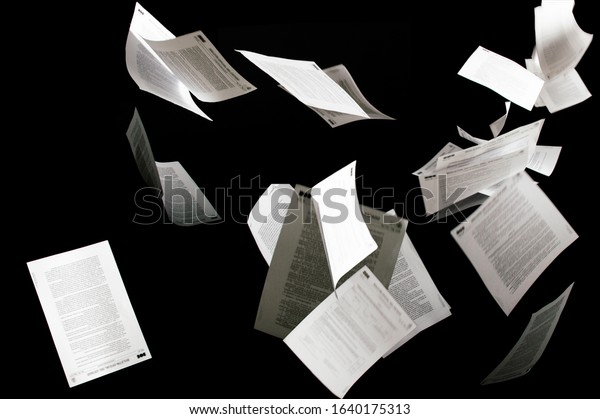 Many flying business\
documents isolated on black background Papers flying in air in\
business concept