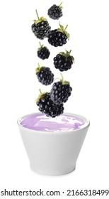 Many Fresh Blackberries Falling Into Bowl Of Yogurt On White Background