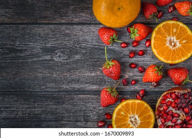Many fresh organic fruits from nature such as strawberry,pomegranate, orange, healthy drinks and food, freshness, beautiful decoration, healthy lifestyle concept top view vintage background,copy space