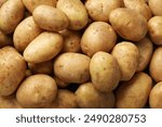 Many fresh potatoes as background, top view