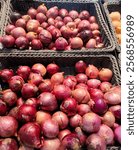 Many of fresh vegetables and local fruits with red onion in big brown baskets shelves of the supermarkets to sell and buy for cooking or eat and shopping for agricultural products, healthy concept

