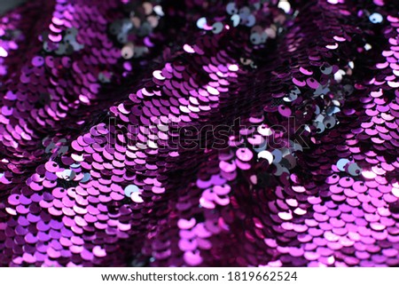 Many fuchsia sequins shining background
