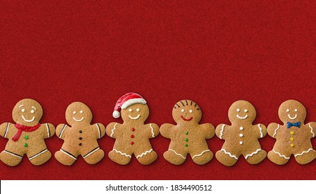 Many Gingerbread Men On A Red Background