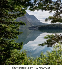 Many Glacier Hotel Through Opening In Trees In Montana