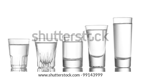 Many glass of vodka isolated on white