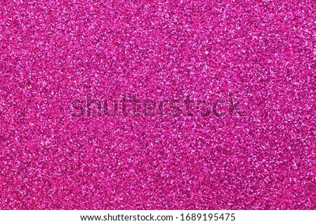 many glitter on the glittery magenta fuchsia background ideal as a backdrop