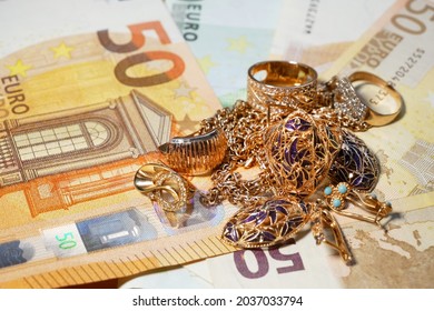 many golden and silver jewerly and money, pawnshop concept, jewerly shop concept, closeup