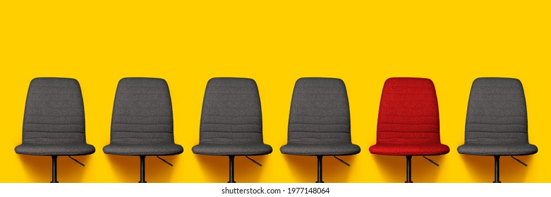 Many Gray Office Chairs And One Red Chair On A Yellow Background. Banner. 