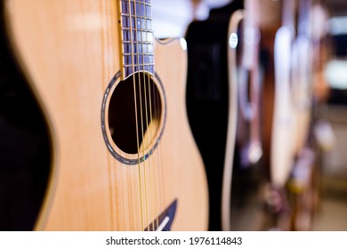 Many Guitars In A Music Store At The Display Window