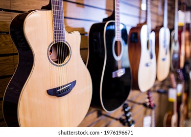 Many Guitars In A Music Store At The Display Window