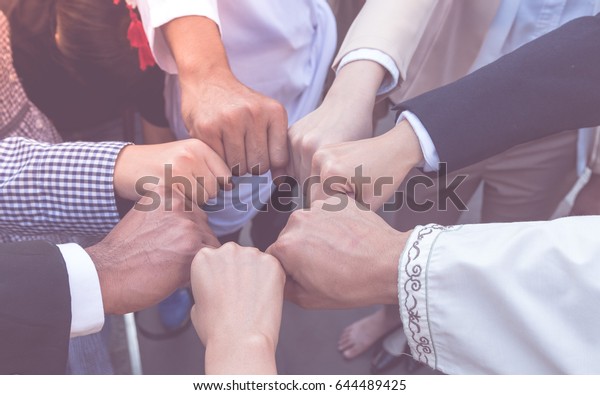 Many hand of business people join respect  teamwork\
Concept partnership touching hands promise for trust mind team. All\
of people promise to do honesty business. Business Team reach an\
agreement .