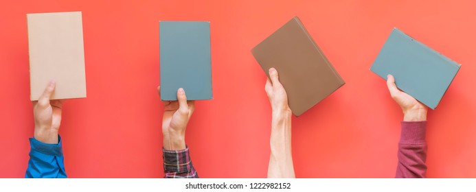 Many Hands Hold Multiple Books Isolated On Color Surface Concept