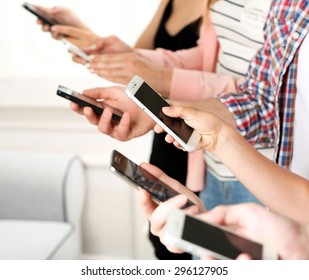 Many Hands Holding Mobile Phones Close Up