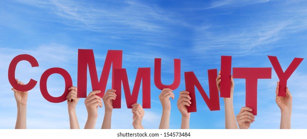 Many Hands Holding the Red Word Community in the Sky - Shutterstock ID 154573484