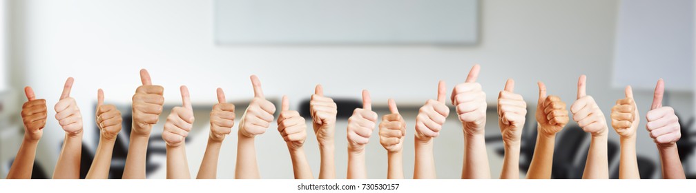 Many hands holding thumbs up as motivation and success - Shutterstock ID 730530157