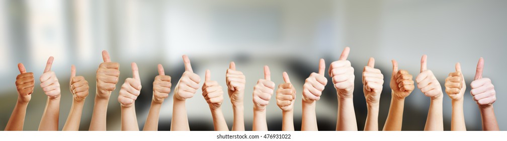 Many hands holding thumbs up in office - Shutterstock ID 476931022