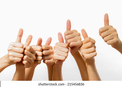 many hands thumbs up shooting in studio - Shutterstock ID 215456836