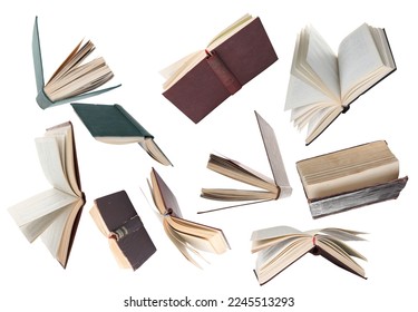 Many hardcover books falling on white background