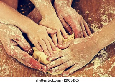 Many Hard-working Hands Mold Dough.