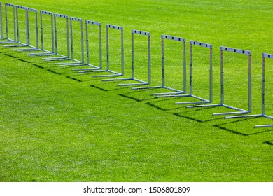 Many Hurdles Standing On Grass As A Border