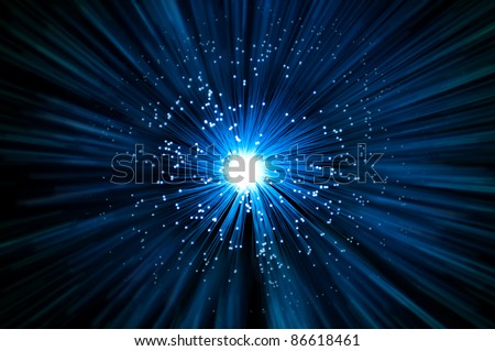 Many illuminated blue fiber optic light strands emitting a blue light effect blur against a dark background.