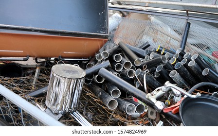 Many Iron Scraps On The Junk Dealer And Metal Pipes