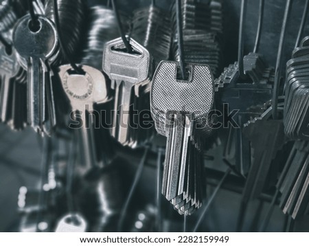 Many key chains for copy key on locksmith shop.