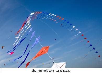 Many Kites Flying In The Blue Sky