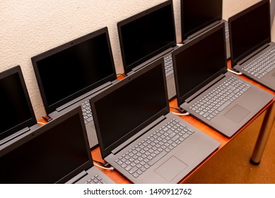 Many Laptops Are On The Table. Computer Exhibition Demonstration. It Technology. Internet Network Office Work. New Gadgets