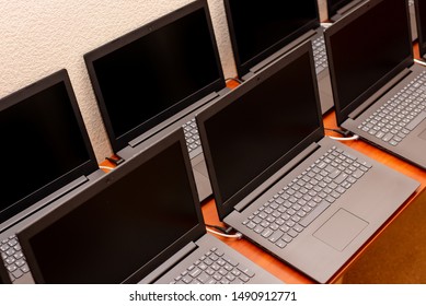 Many Laptops Are On The Table. Computer Exhibition Demonstration. It Technology. Internet Network Office Work. New Gadgets