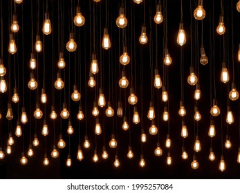many light bulbs hanging at a ceiling