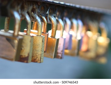 Many locks on the railing of the bridge