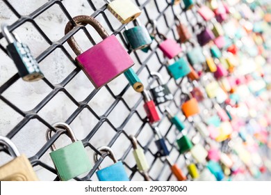 Many love locks on fence concept with selective focus on a blank lock at foreground - Powered by Shutterstock