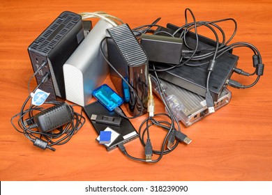 Many memory devices like hard disk drives or memory cards, in format USB or Firewire, with a lot of entangled cables