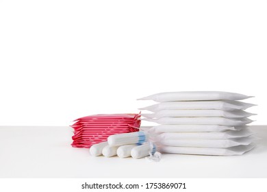 Many Menstrual Sanitary Pads And Cotton Tampons On White Background. Feminine Hygiene Products