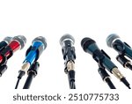 Many microphones with stands isolated on white background for press conference, high quality dynamic microphone