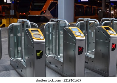 Many modern turnstiles on station. Fare collection system
