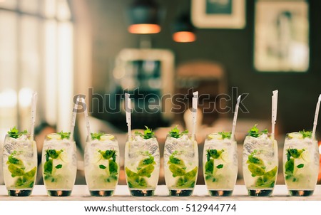 many-mojito-cocktail-on-background-450w-512944774.jpg